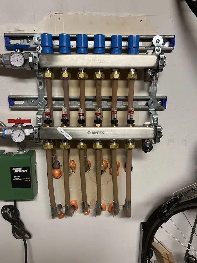 Plumber performing Gas Line Installation at a residential property in Long Branch